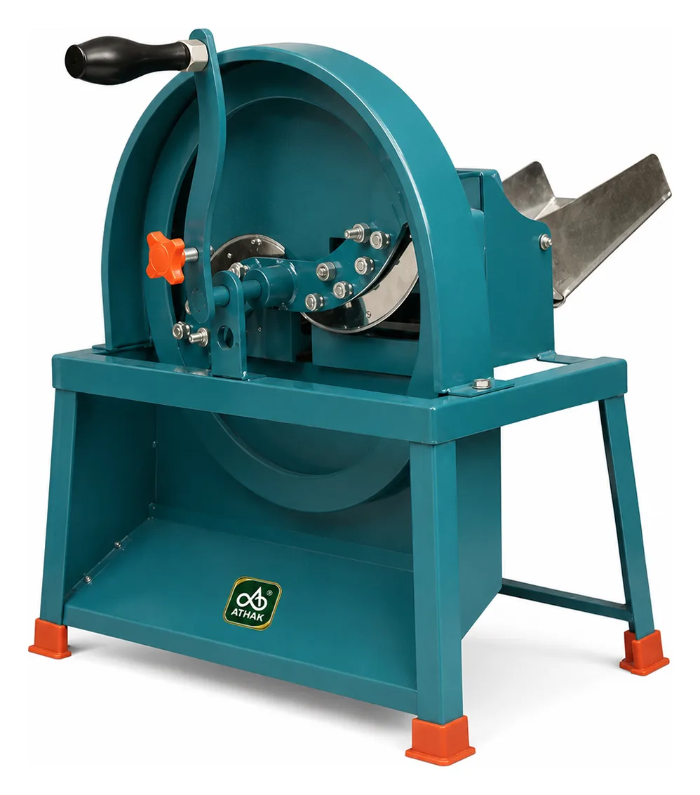 ATHAK Bhaji Cutter with hand wheel, blade assembly and stainless steel feed chute on a teal stand